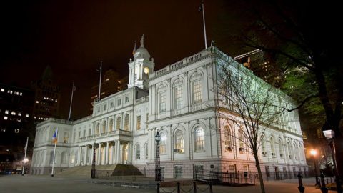 New York City Hall lit up at night. Photo by Rian Castillo/Creative Commons.