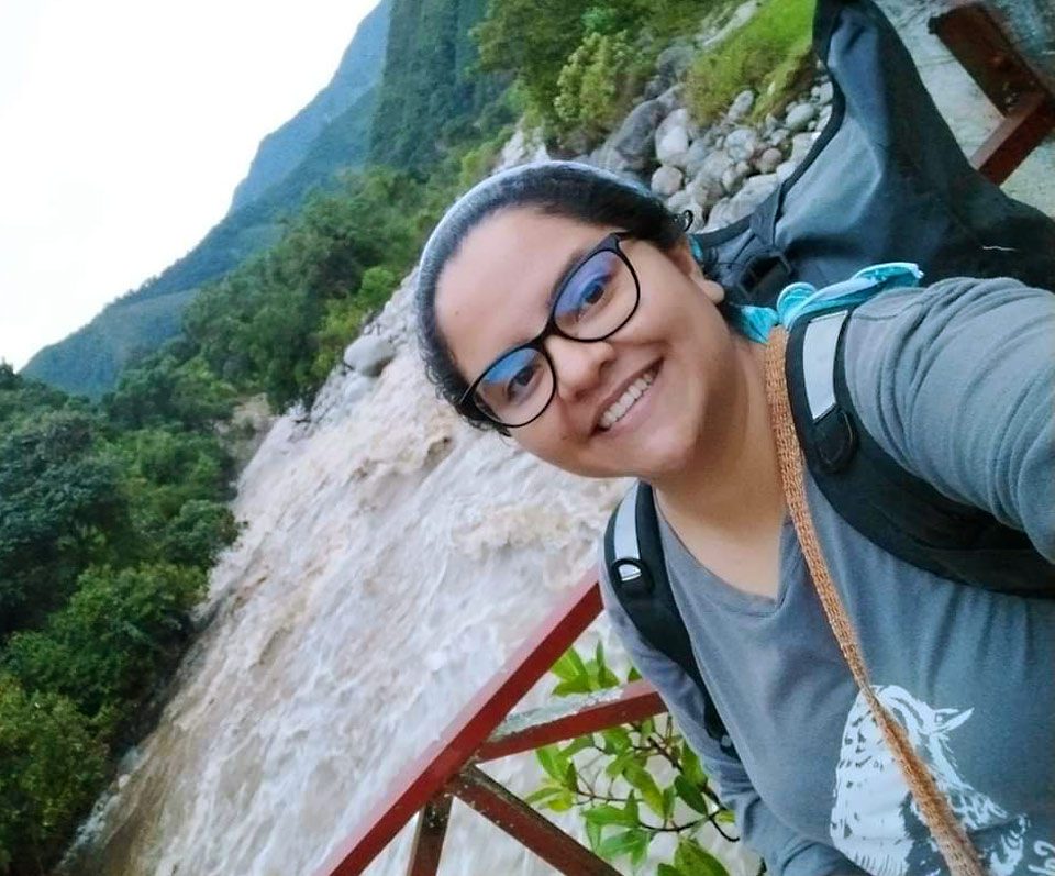 woman standing on bridge